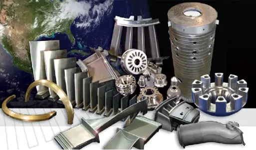 Diverse metal components and machinery parts on a workbench.