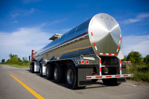 A massive tanker truck driving on the road.